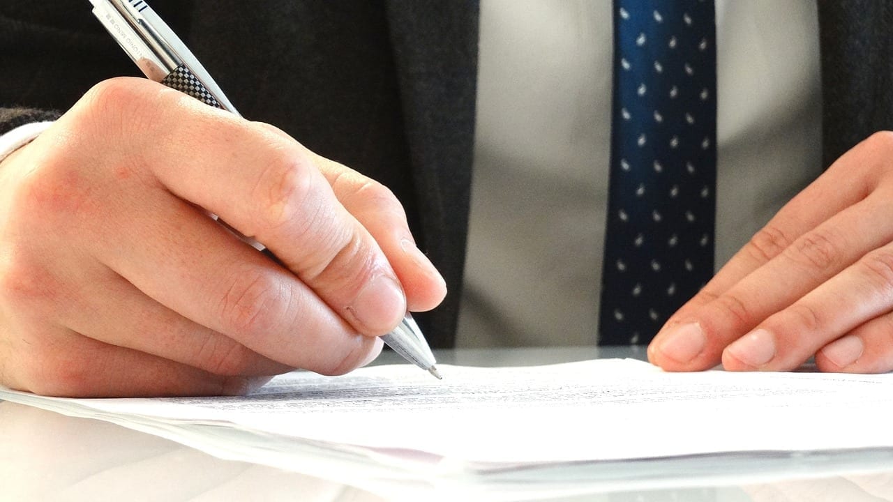 Lawyer writing on a sheet of paper