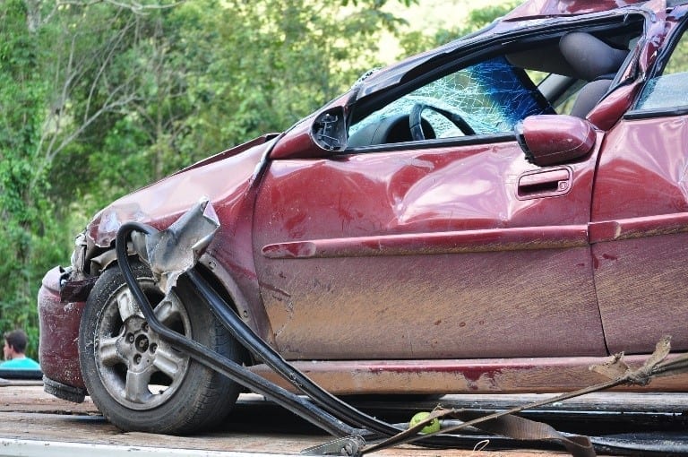 Road accident with red car