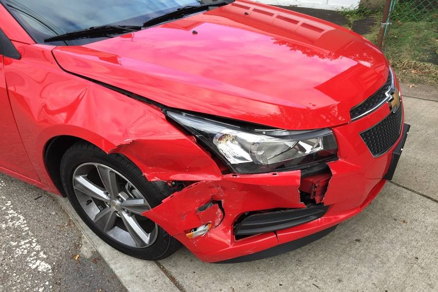 Red vehicle in auto accident