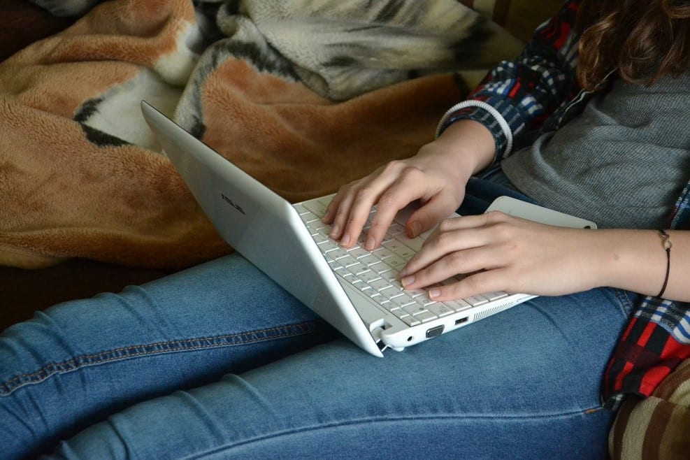 Woman typing on a laptop