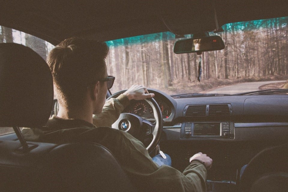 Teen driving a car