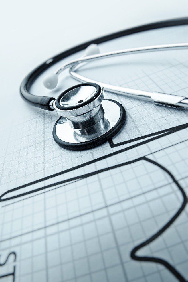 A stethoscope placed on a graph paper