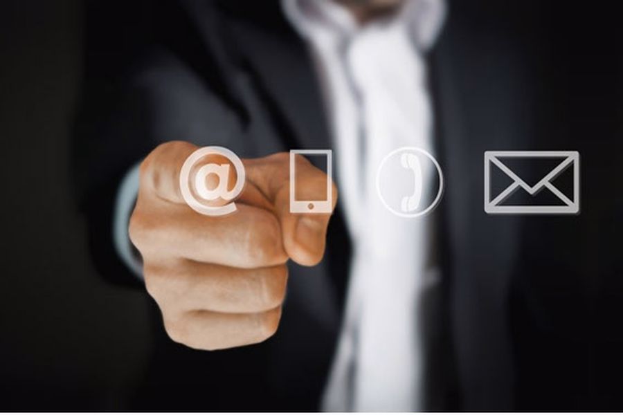 Man pointing at Cellphone and Email symbols
