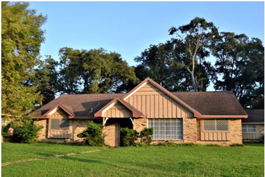 House with a trimmed lawn