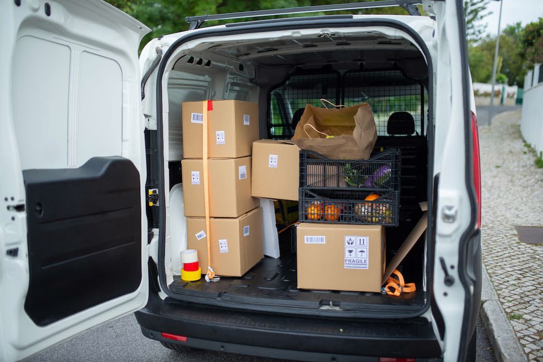 Brown packages stacked together inside a van