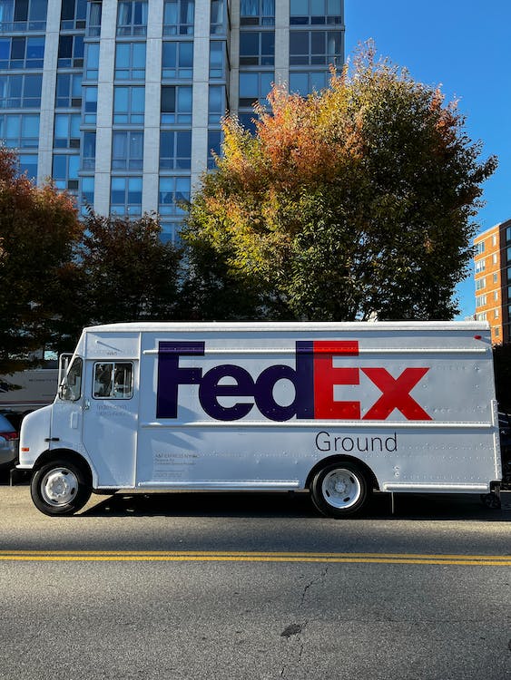 FedEx truck parked by the side of the road