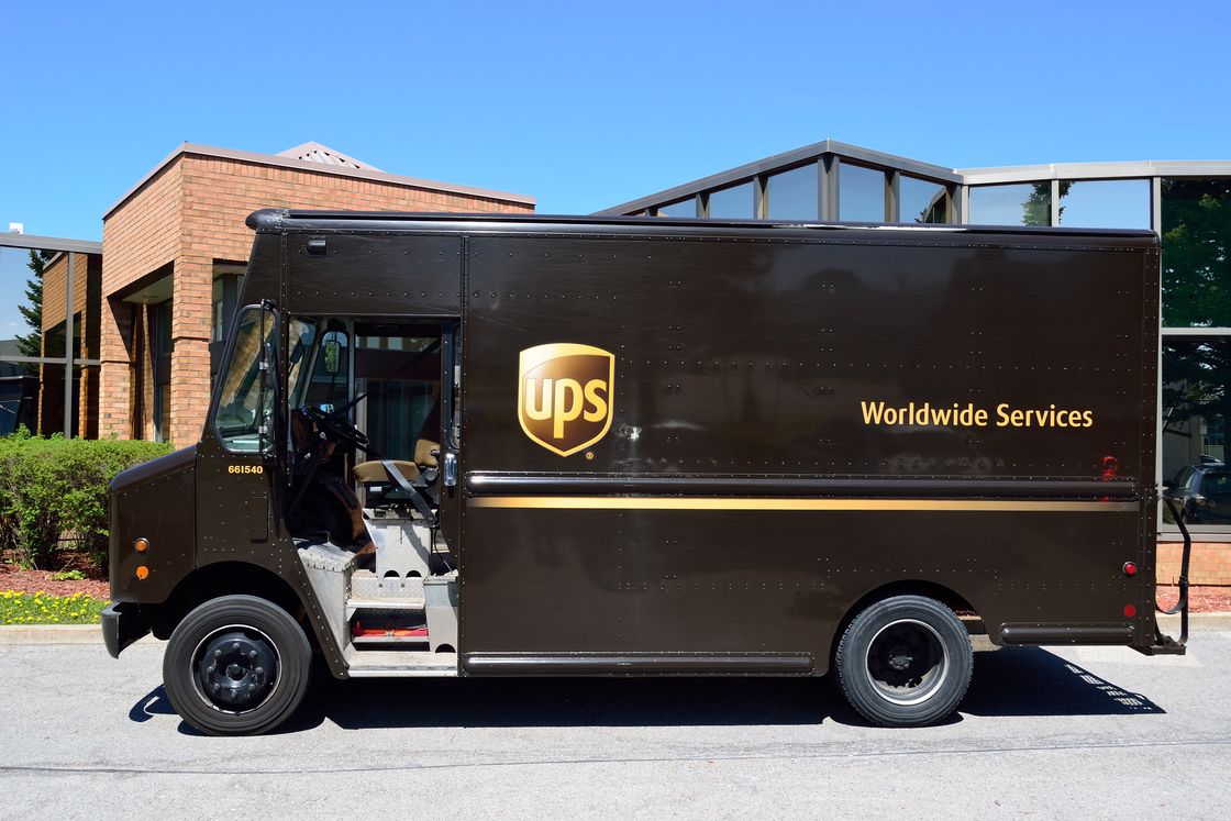 UPS truck parked on the side of a residential neighborhood