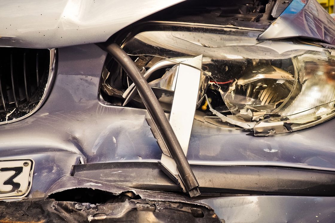 Close-up of a wrecked front end of a car