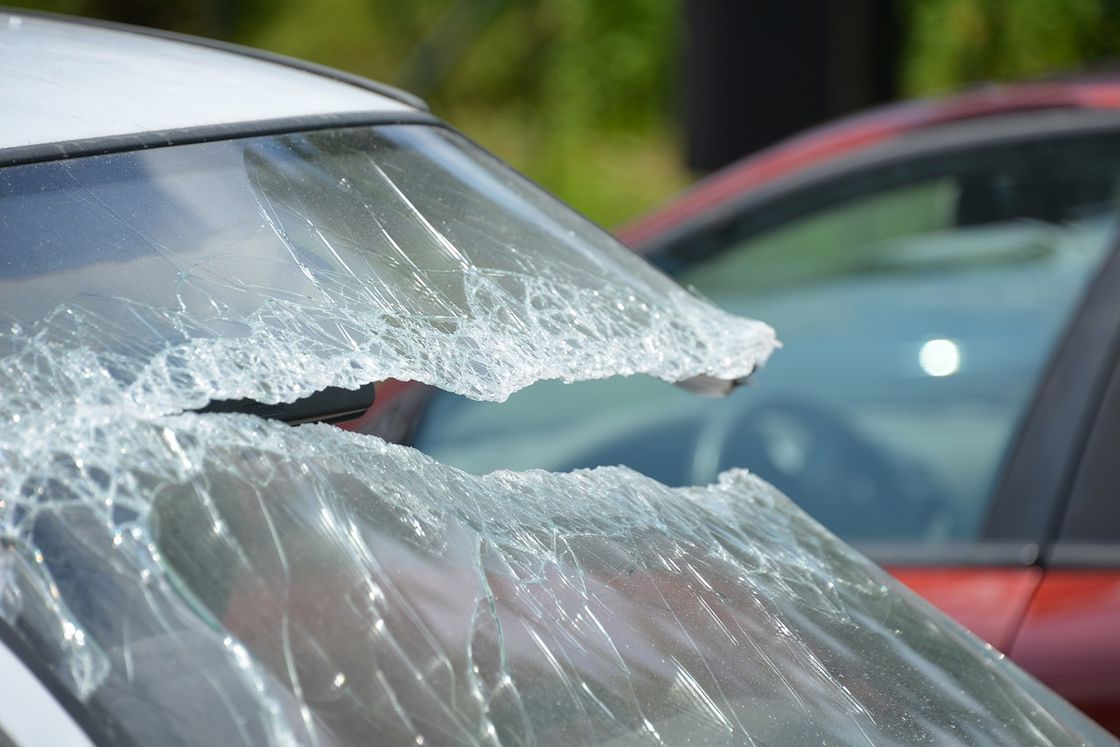 Close up of a badly broken windshield after a car accident