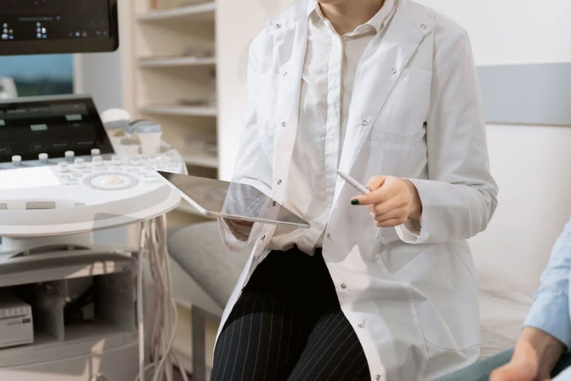 Doctor sitting down with her patient while explaining her test results