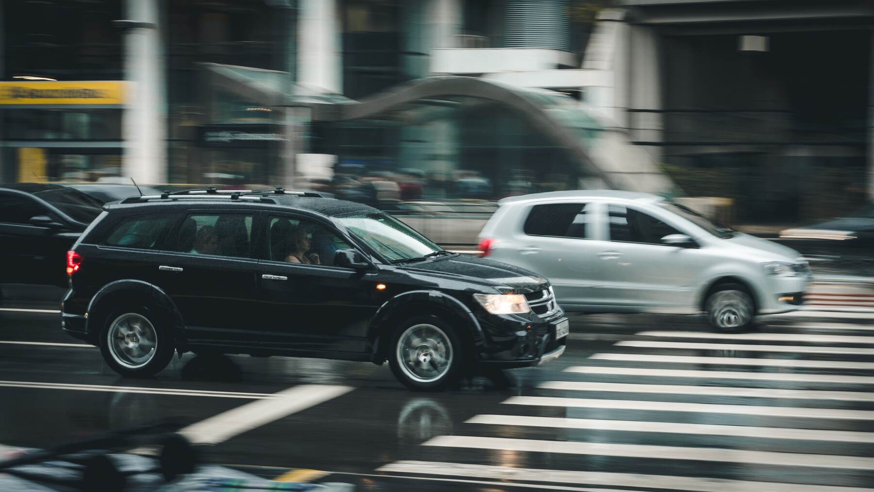 Cars driving past a pedestrian crossing