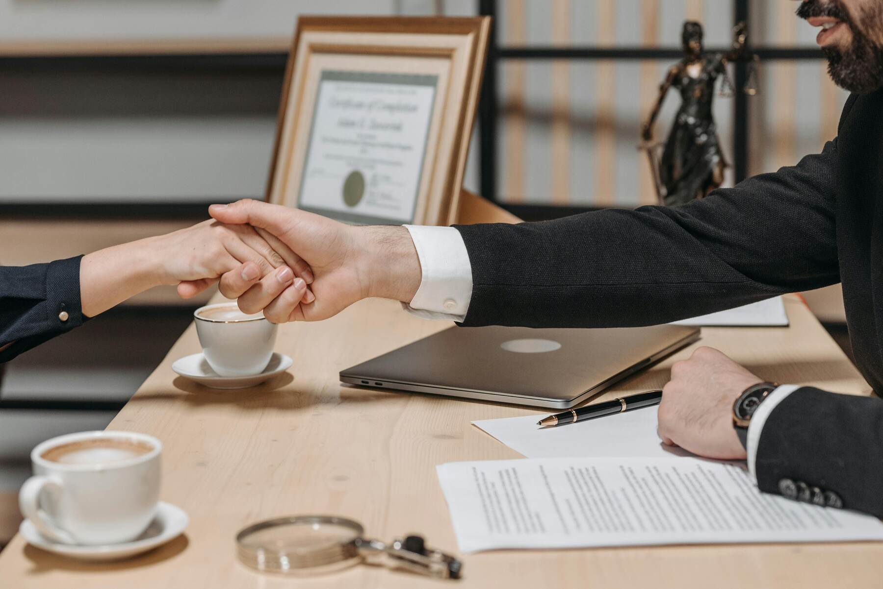 Lawyer shaking hands with client after a meeting