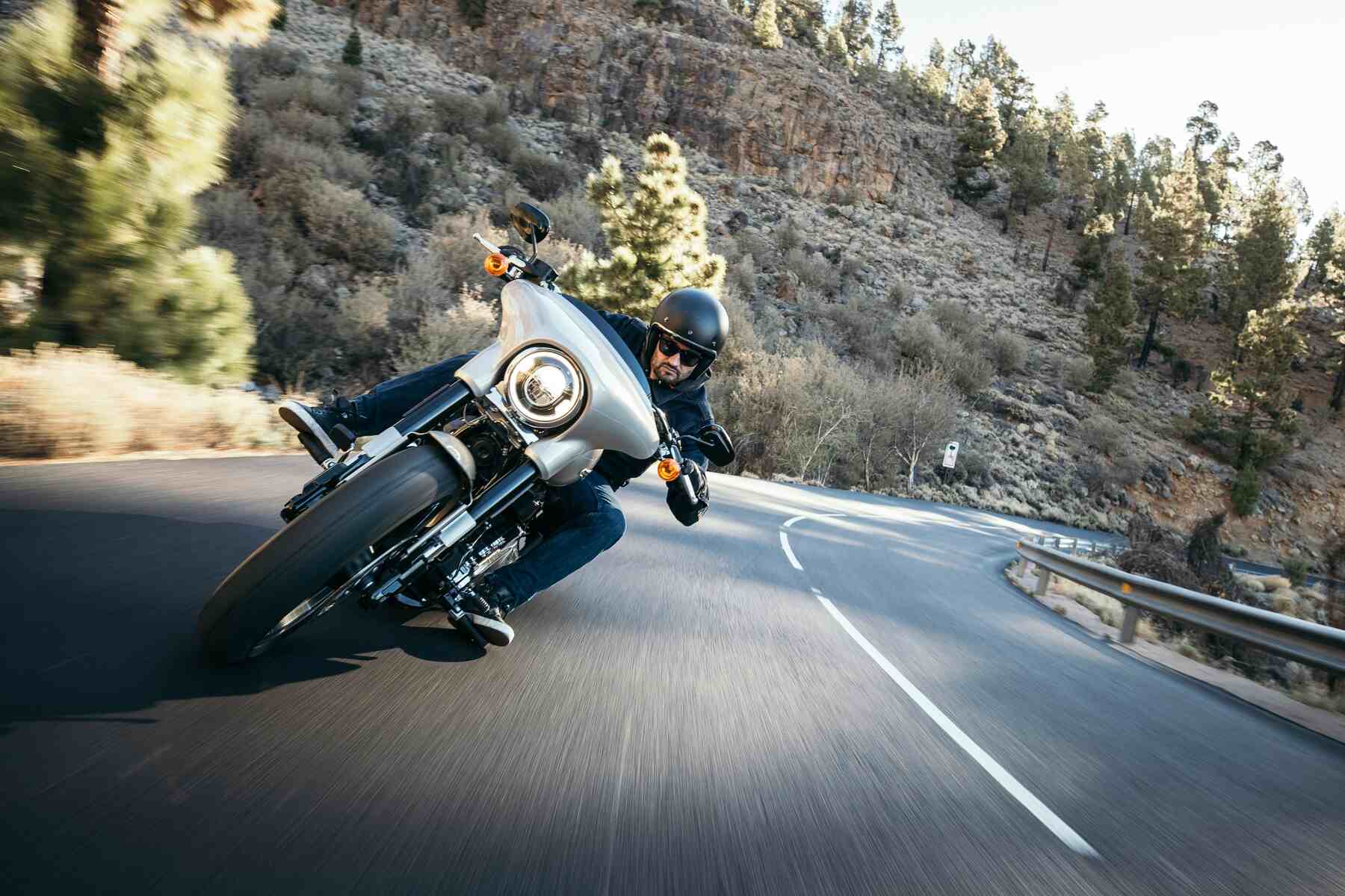 Man making a dangerous turn on the highway with his motorcycle