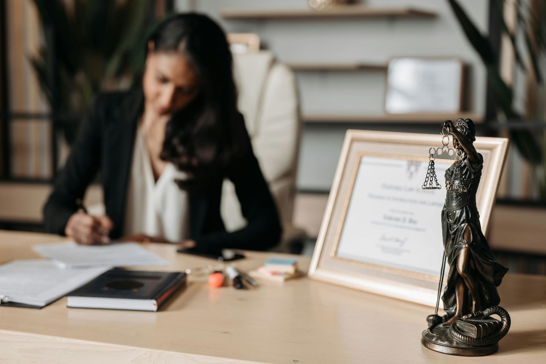 Lady Justice figurine on a lawyer's table