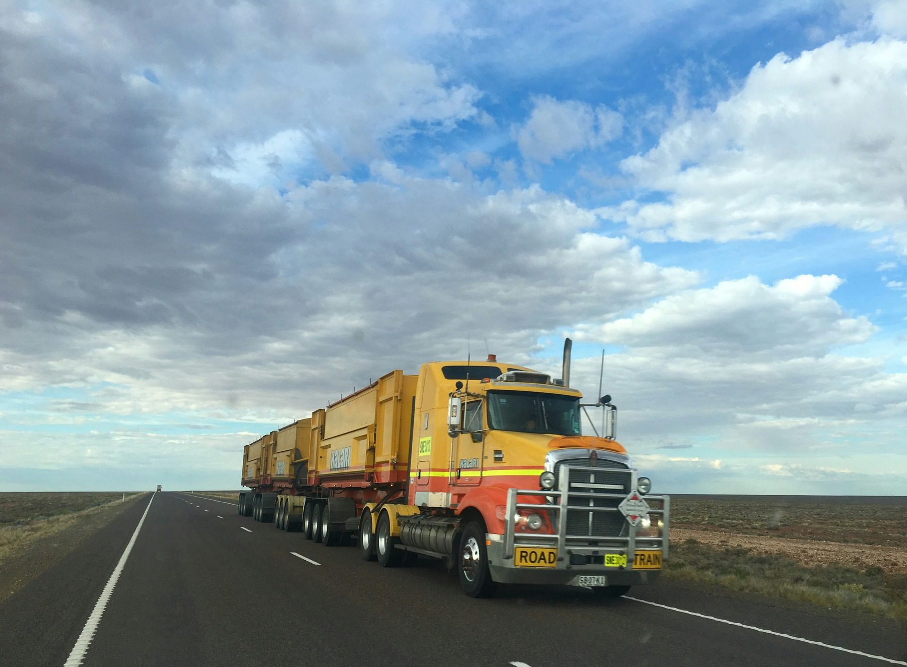 Truck driving on an empty highway