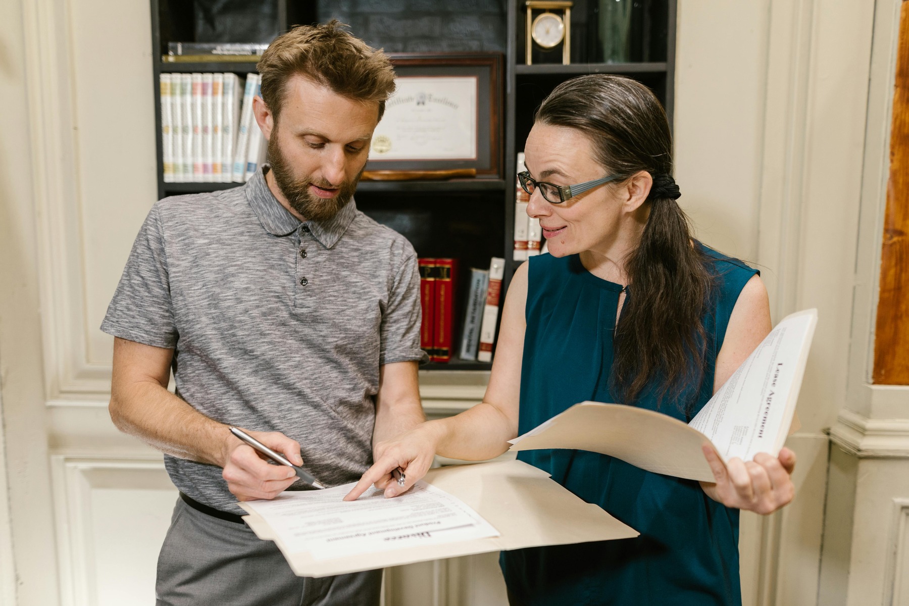 A man talking to a woman in an office