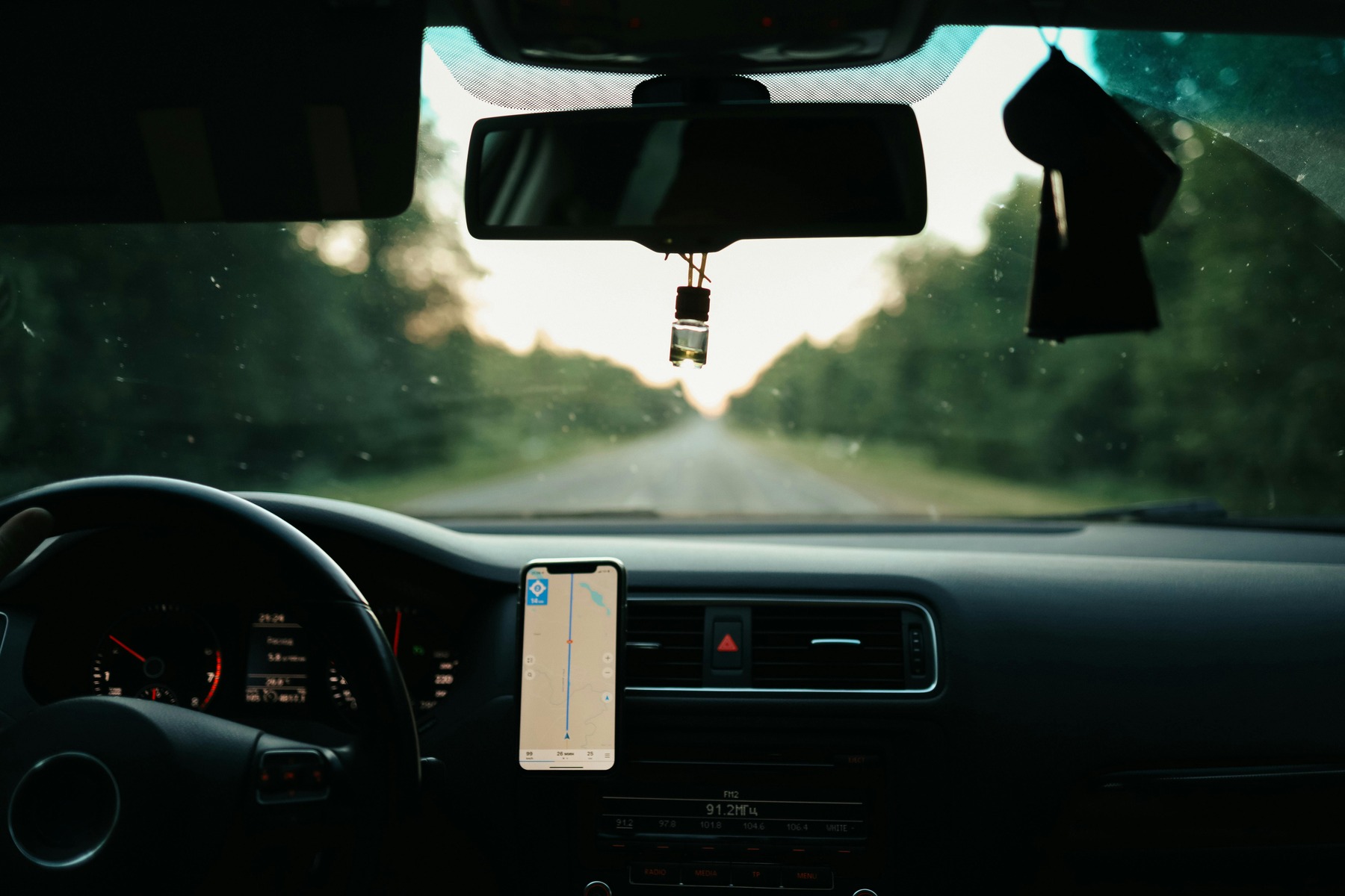 A passenger view of a car on the road