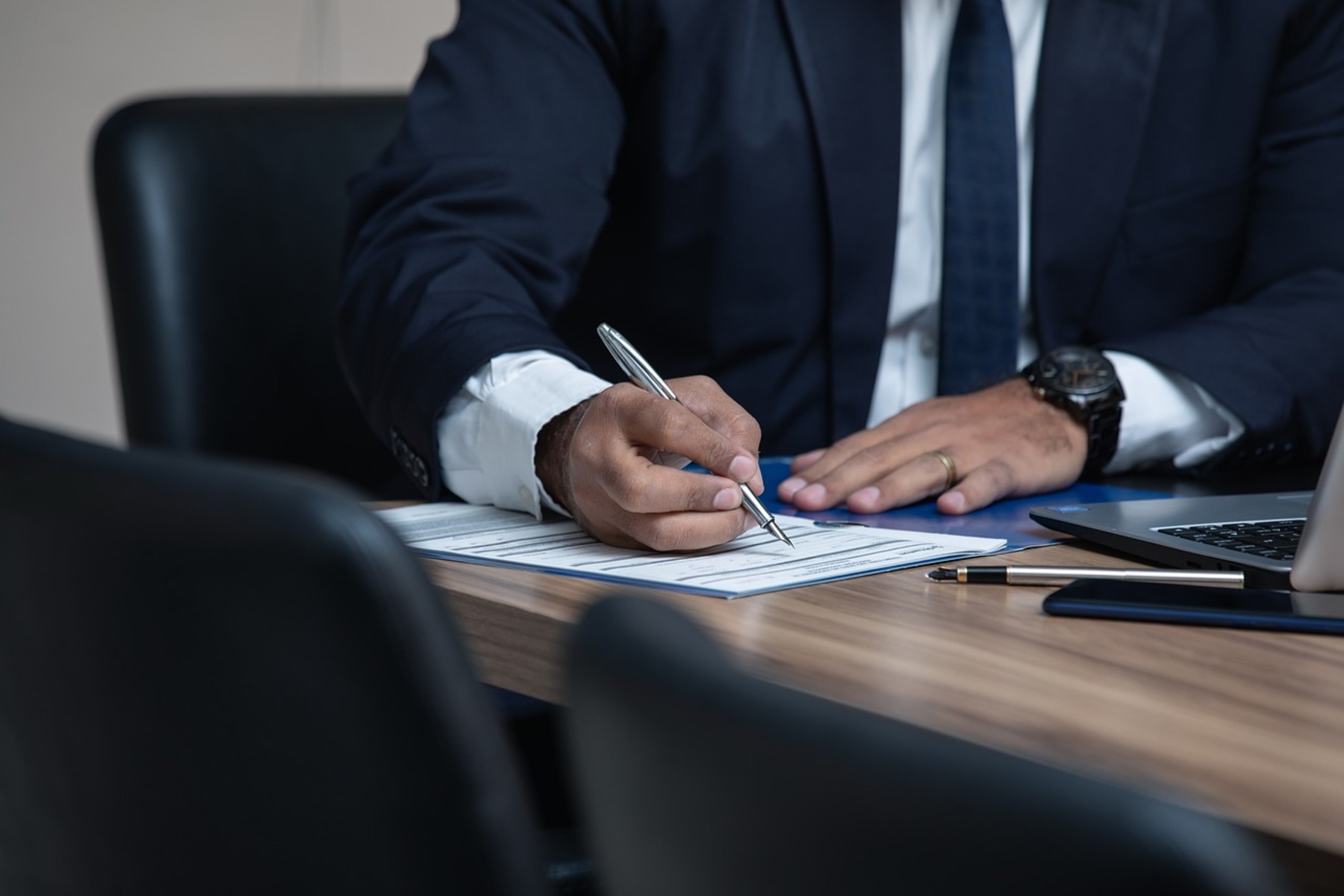 A lawyer writing on a document