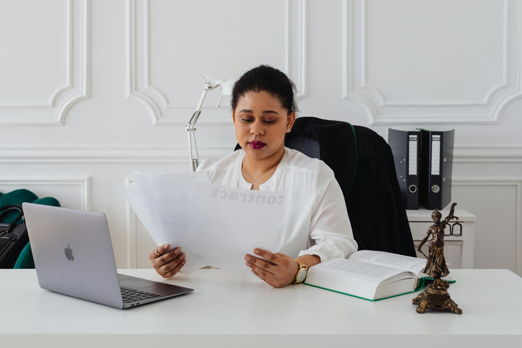A lawyer in her table scanning documents