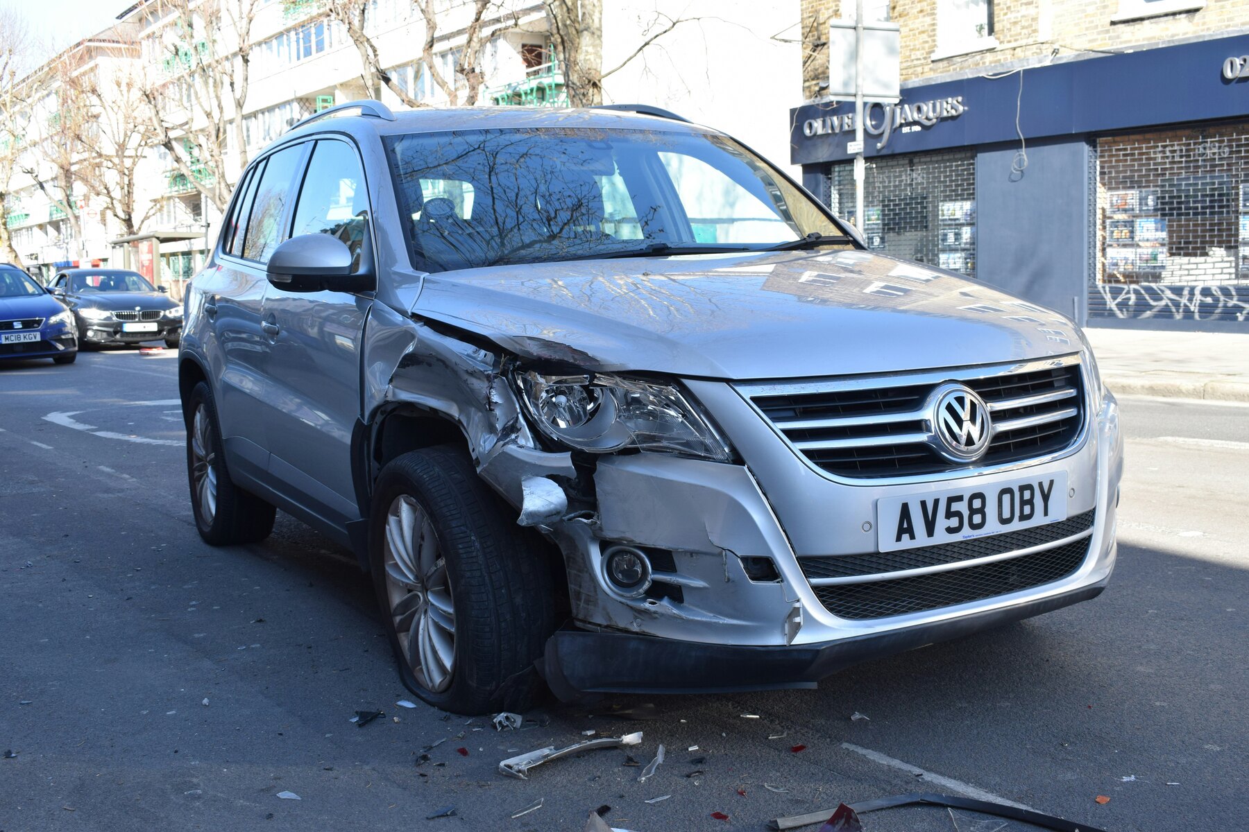 Gray car with a damaged bumper